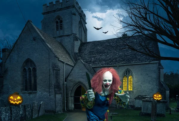 an evil clown with a knife in front of an old church