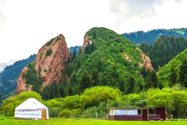 Jeti Oguz Resort Landscape with Broken Heart Rock Terskey Ala Too Mountain Range Yurt Camp clipart