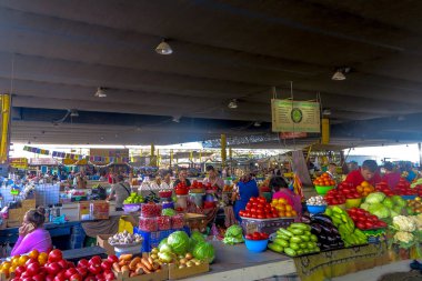 Odessa Privoz Market Stores with People Selling Vegetables and Fruits clipart