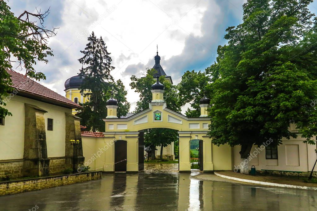 Capriana Monastery Complex Main Gate Entrance View with Rainy Clouds