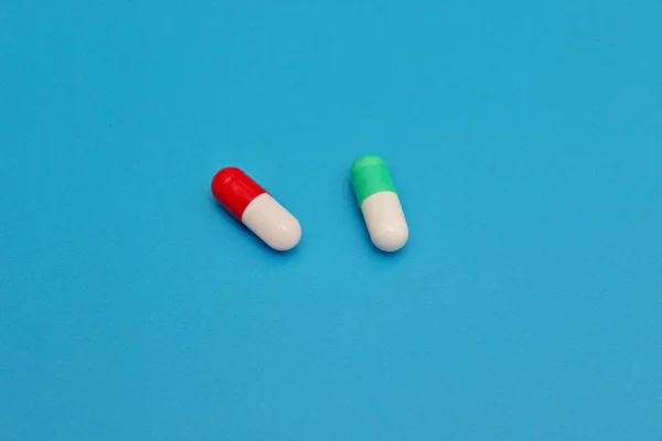 Pharmacology pills on blue background — Stock Photo, Image