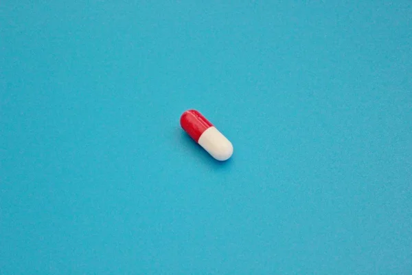 Pharmacology pills on blue background Royalty Free Stock Photos