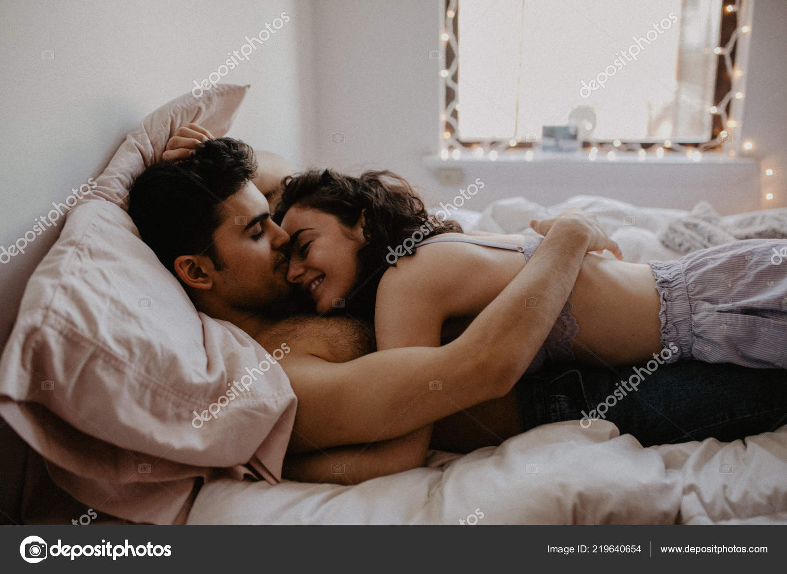Young Loving Couple Having Romantic Times Bedroom Stock