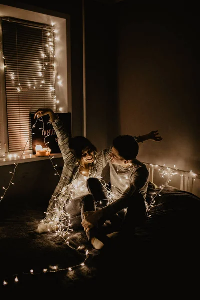 Happy Couple Love Siting Bed Enjoy Each Other Wrappeding Garland — Stock Photo, Image