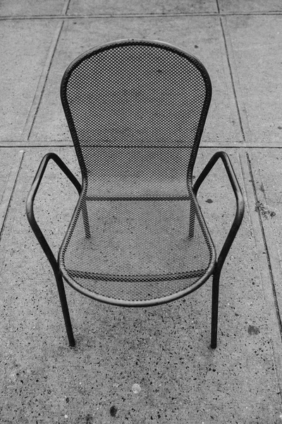 Steel garden chair on background