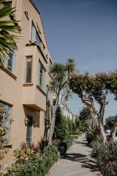 Descending row of stately houses on hill in San Francisco, California, USA