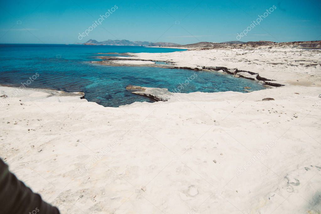 Azure sea shore on background