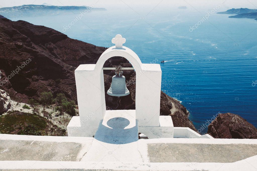 Greek white bell. Sea background