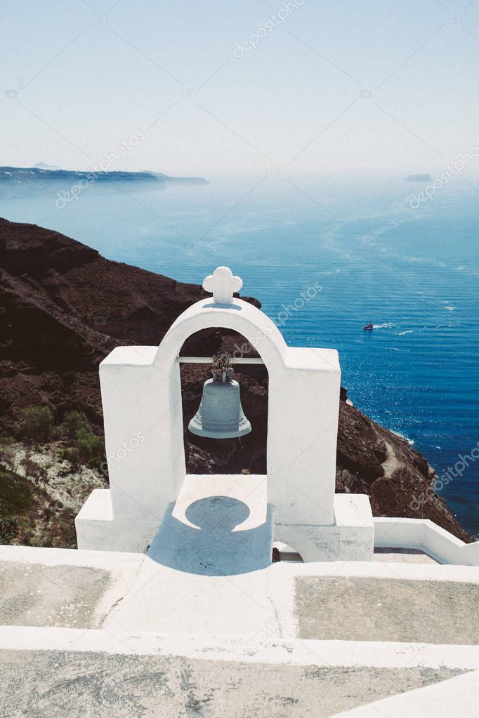 Greek white bell. Sea background