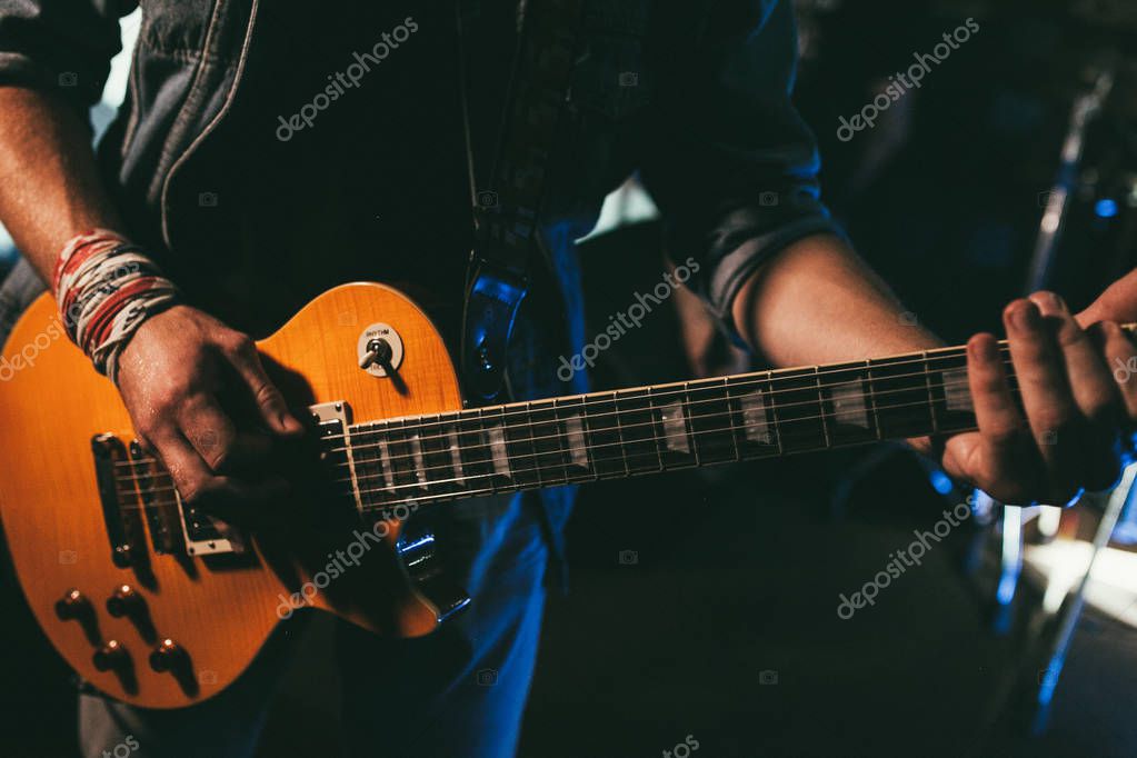 Electric Guitar Player On Background Close Up Larastock Electric Guitar Player On Background Close Up Larastock