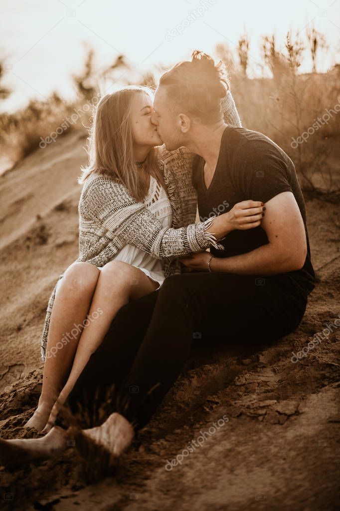 happy couple in love spend good time on the beach and enjoy each other