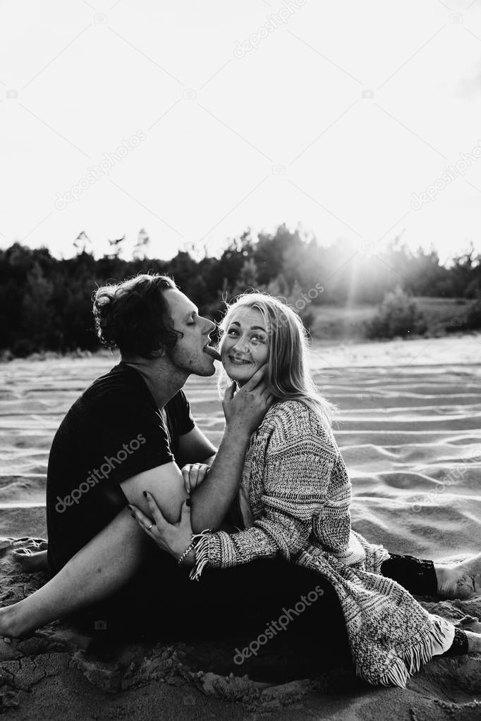happy couple in love spend good time on the beach and enjoy each other