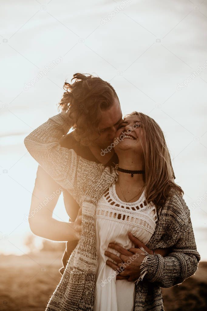 happy couple in love spend good time on the beach and enjoy each other