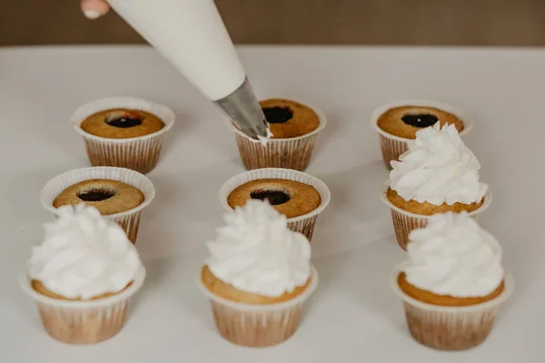 woman in cooking dessert cupcakes