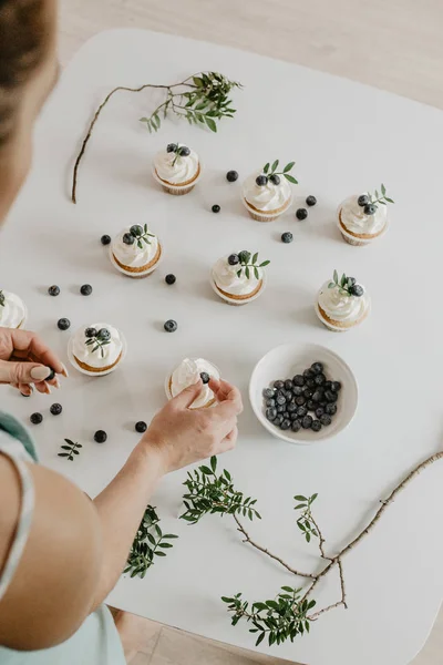 woman in cooking dessert cupcakes