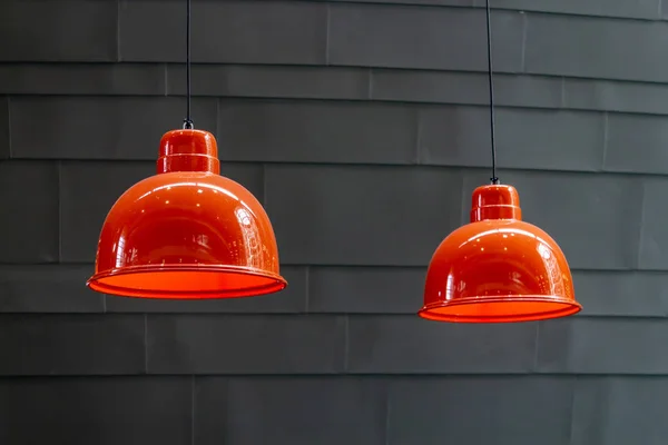 Orange ceiling lamp on gray background wall