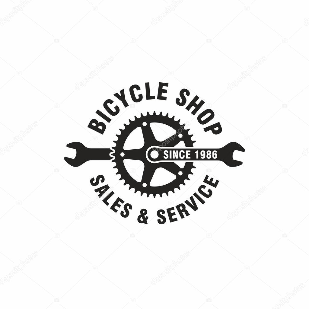 Black and white illustration of a wrench, bicycle gear, text on a white background. Vector illustration advertises the sale and service of bicycles. Bicycle shop logo.
