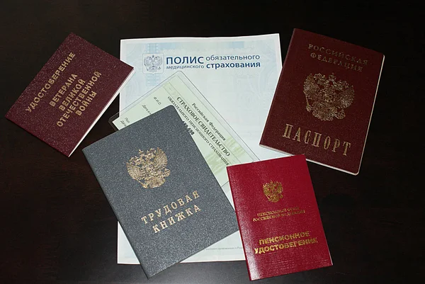 Passport, labor document, pension ID, medical insurance.