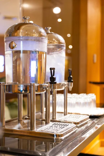 Drinking water in juice dispenser cooler — Stock Photo, Image