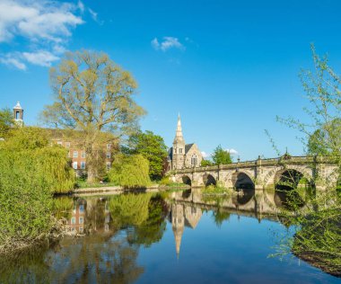 Blue sky and reflections captured in the River Seven by the English Brigde clipart