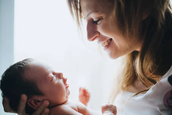 Happy Mother Holding Her Small Newborn Baby Closeup Backlit Portrait — Stock Photo, Image