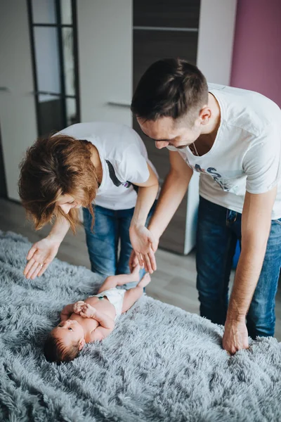 Happy Mother Father Talking Newborn Baby Playing Her — Stock Photo, Image