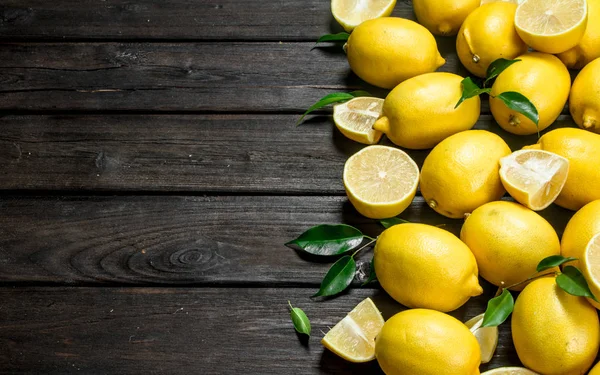 Juicy sour lemons with leaves.