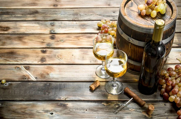 Wine background. White wine in an old barrel.