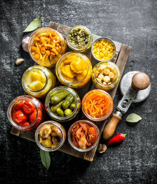 Preserved food on wooden tray.