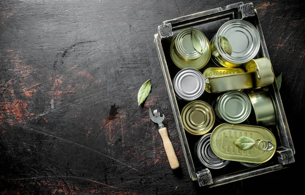 Canned food in closed cans in a box.