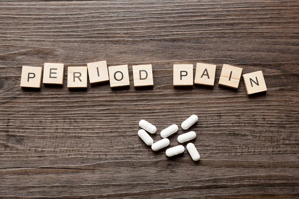 The word Period Pain along with paracetamol tablets