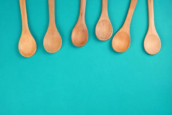 Wooden Spoons Set Bright Turquoise Background Culinary Cooking Concept Top — Stock Photo, Image