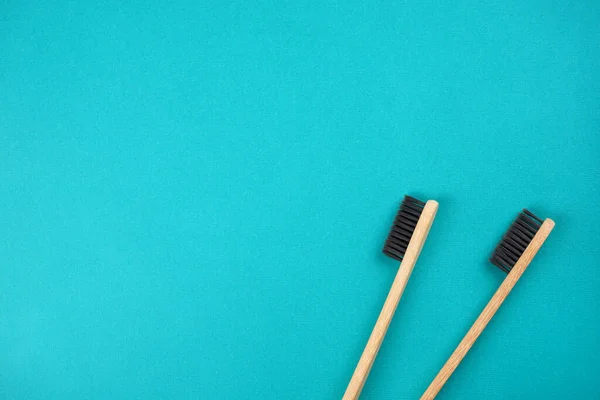 Two Bamboo Toothbrushes Turquoise Background Love Healthcare Zero Waste Treatment — Stock Photo, Image