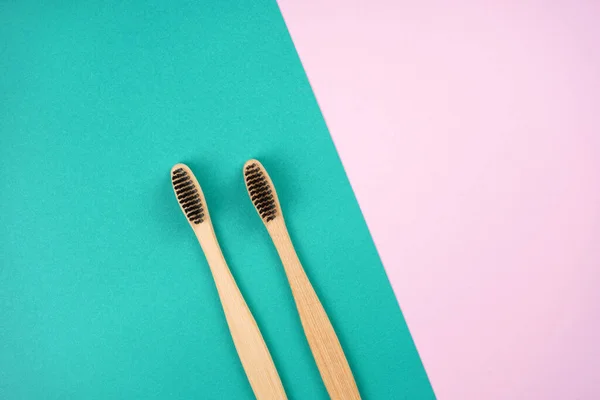 Two Bamboo Toothbrushes Turquoise Pink Background Love Healthcare Zero Waste — Stock Photo, Image