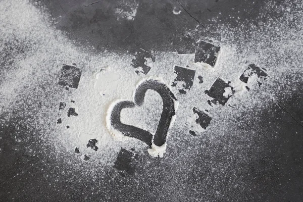 granite black table with flour and a heart shape, Copy text