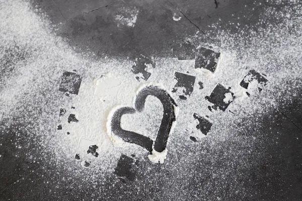 granite black table with flour and a heart shape, Copy text
