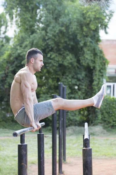 Young Muscular Man Perfect Body Doing Exercises Parallel Bars Park — Stock Photo, Image