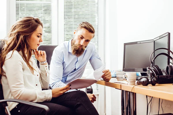 Team job succes. Photo young business managers working with new startup project in office. Analyze document, plans.Paperwork on wooden table, papers, documents