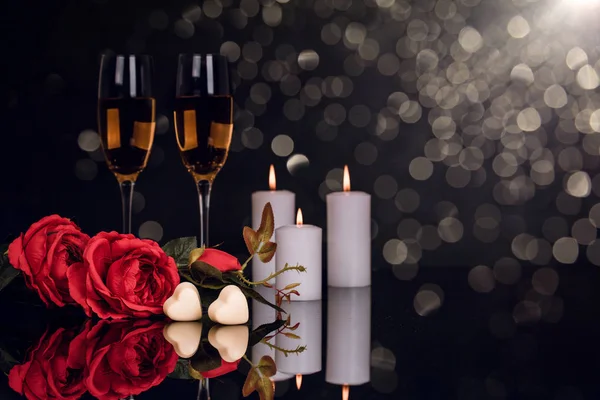 Two Glasses Champagne Roses Candles Two Heart Shape Chocolates Lights — Stock Photo, Image