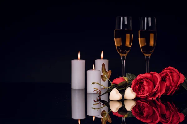 Two Glasses Champagne Roses Candles Two Heart Shape Chocolates Black — Stock Photo, Image