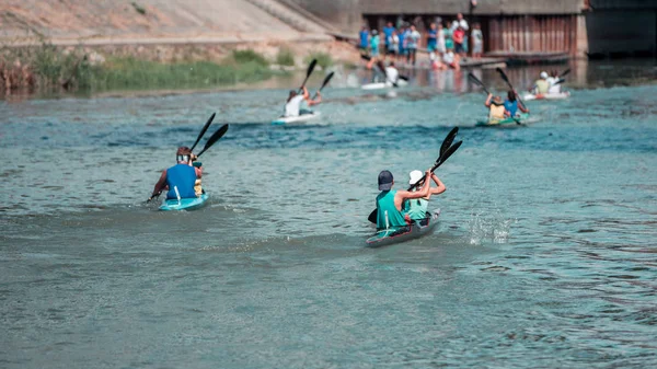 Team of a young man and woman athlete on rowing kayak on water, — Stock Photo, Image