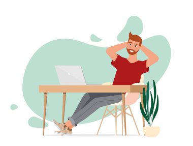 Serbest çalışan bir adam dizüstü bilgisayarla çalışır. Ev ofis işyeri.