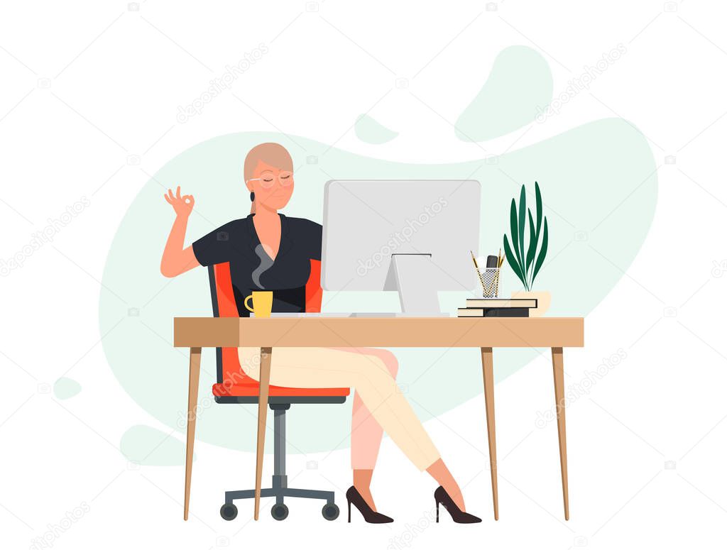 Woman meditates at work place