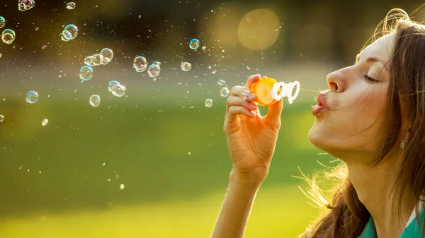 Beautiful Girl Blowing Soap Bubbles — Stock Photo, Image