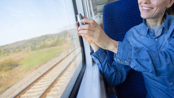 Beautiful Girl Traveling Train Using Phone Loking Out Window — Stock Photo, Image