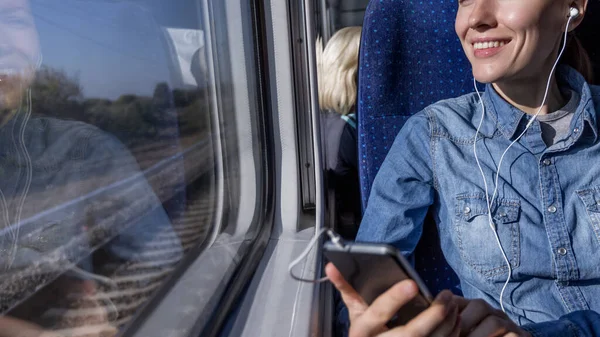 Beautiful Girl Traveling Train Using Phone Loking Out Window — Stock Photo, Image