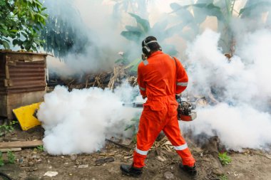 Worker fogging to eliminate mosquito for preventing spread dengue fever and zika virus clipart
