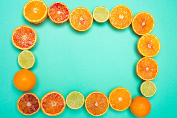 Frame from slices of orange and citrus. Space for text. Top view.