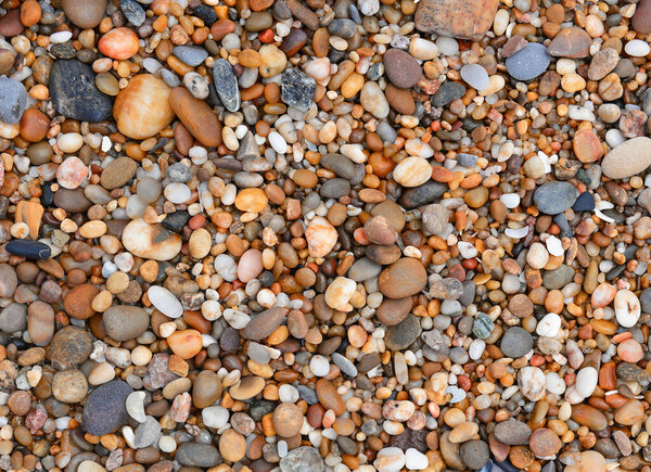 Rolled pebbles on a beach.