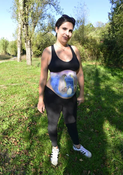 Belly painting on a pregnant woman.